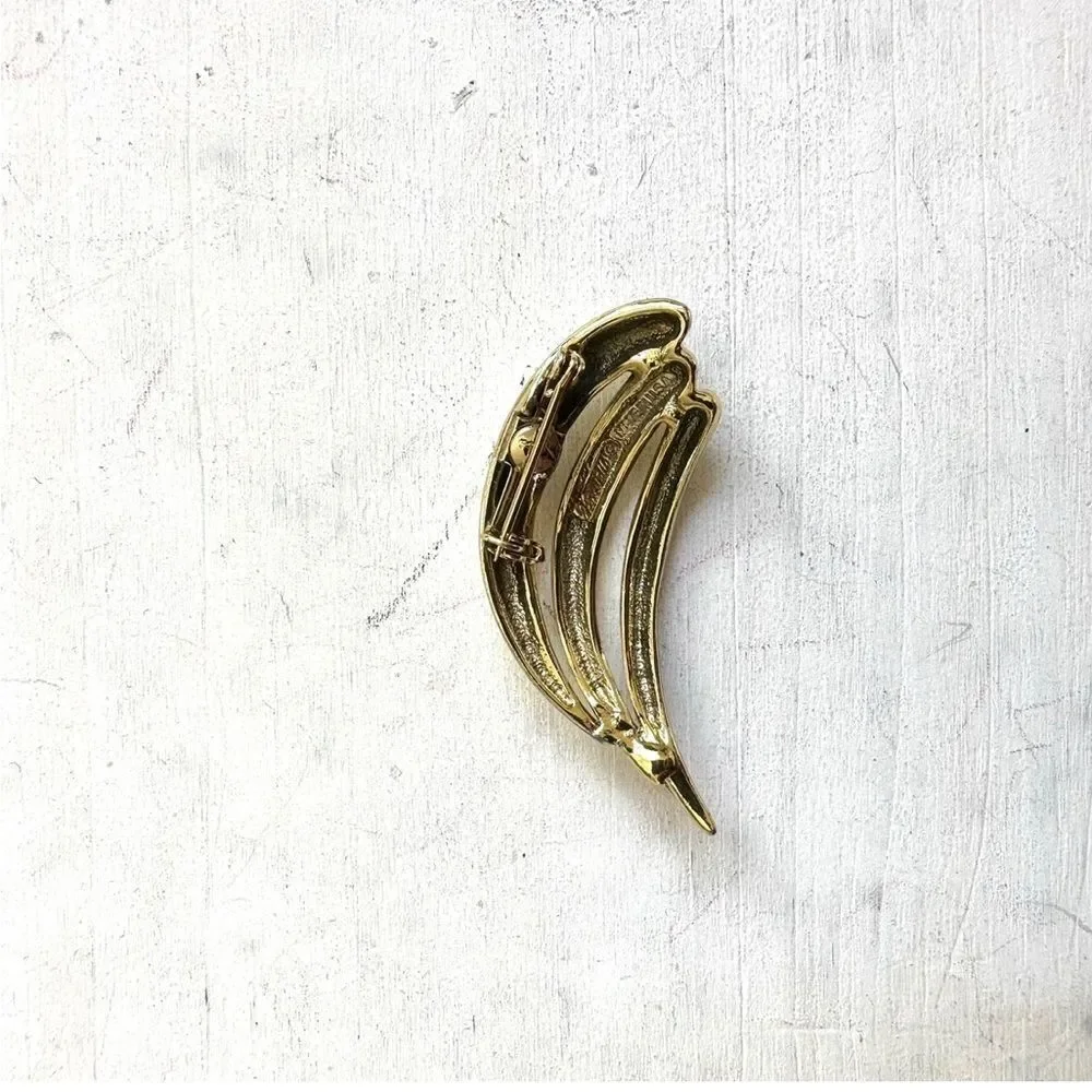 Gold tone brooch